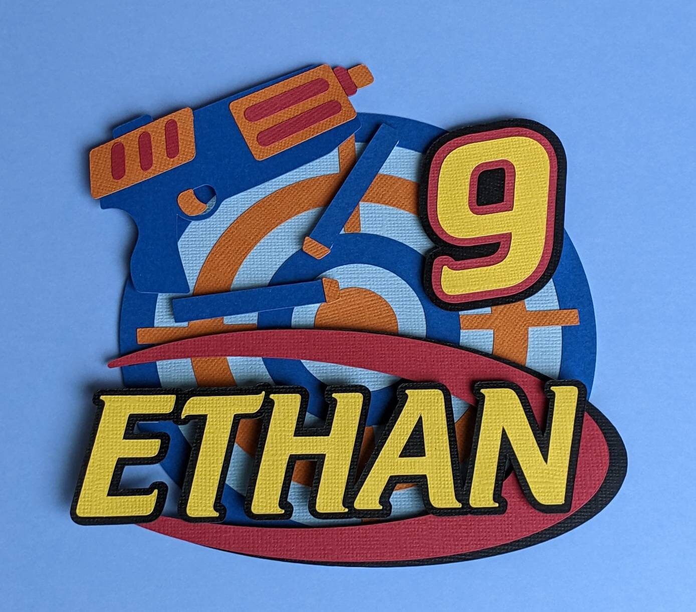 Personalised shooter target cake topper